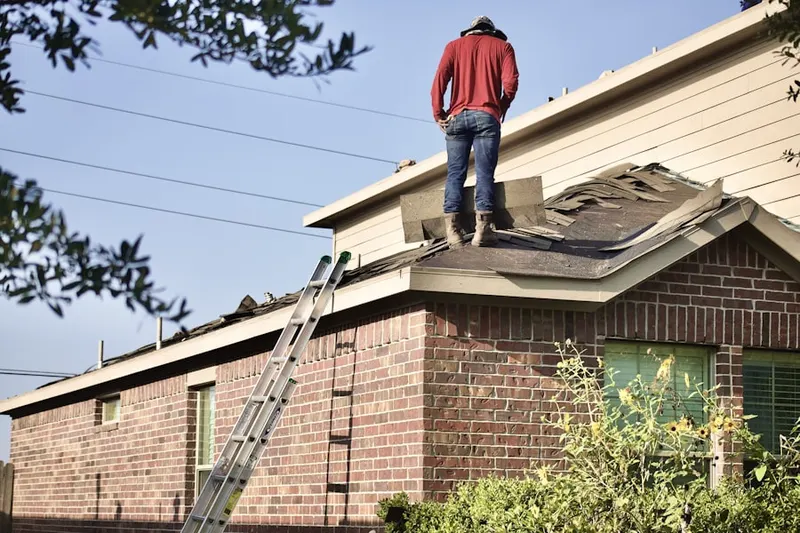 Professional roofer working on a residential roof in Lake Forest